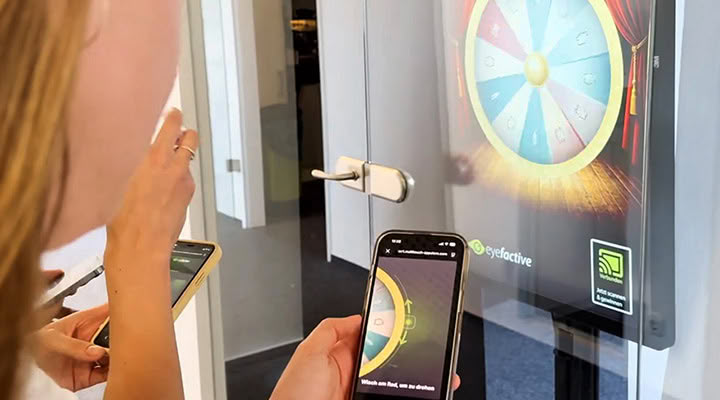 Remote shop window control: spinning a wheel of fortune by smartphone