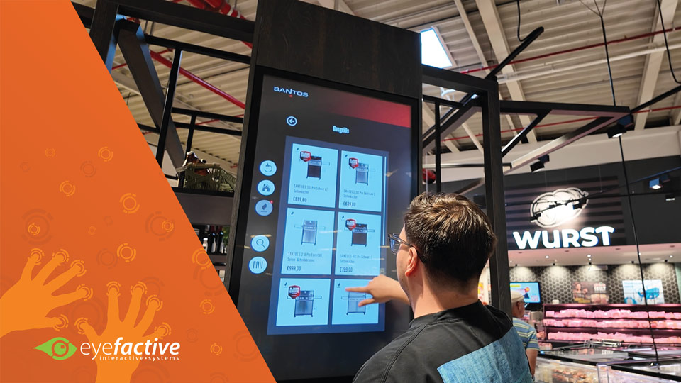 Interactive touchscreen kiosk in the Santos Barbecue World at EDEKA Magdeburg